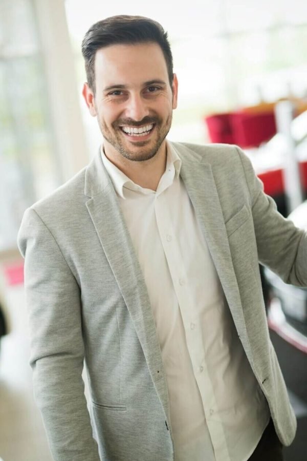 car-salesman-calculating-a-price-at-the-dealership-office